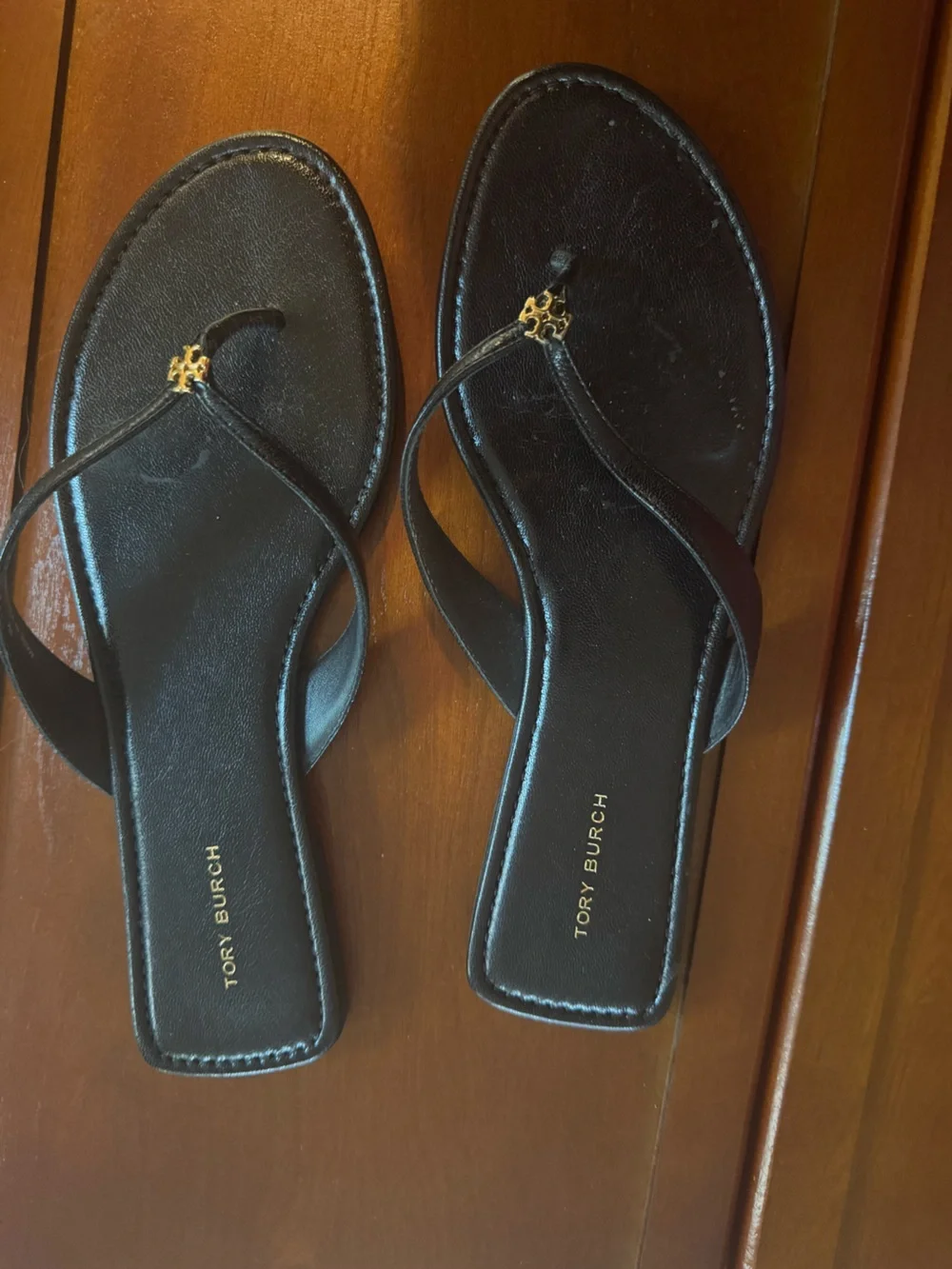 Tory Burch Black Leather Thong Sandals with Gold Logo Accent